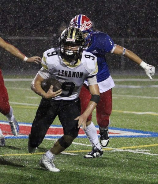 Brendan Shockley rushes the ball against Western Boone on Oct. 13, 2023